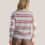 a woman wearing a striped sweater