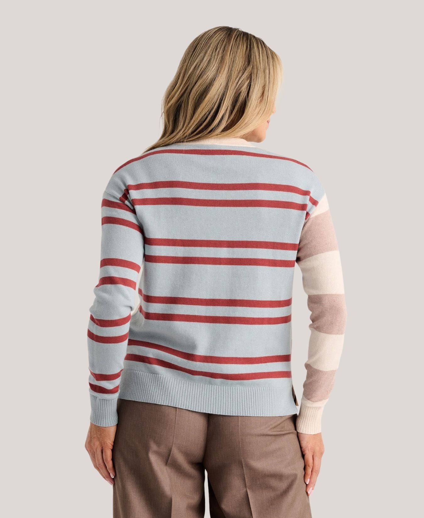 a woman wearing a striped sweater