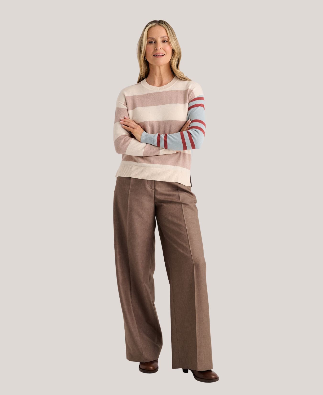 a woman with her arms crossed