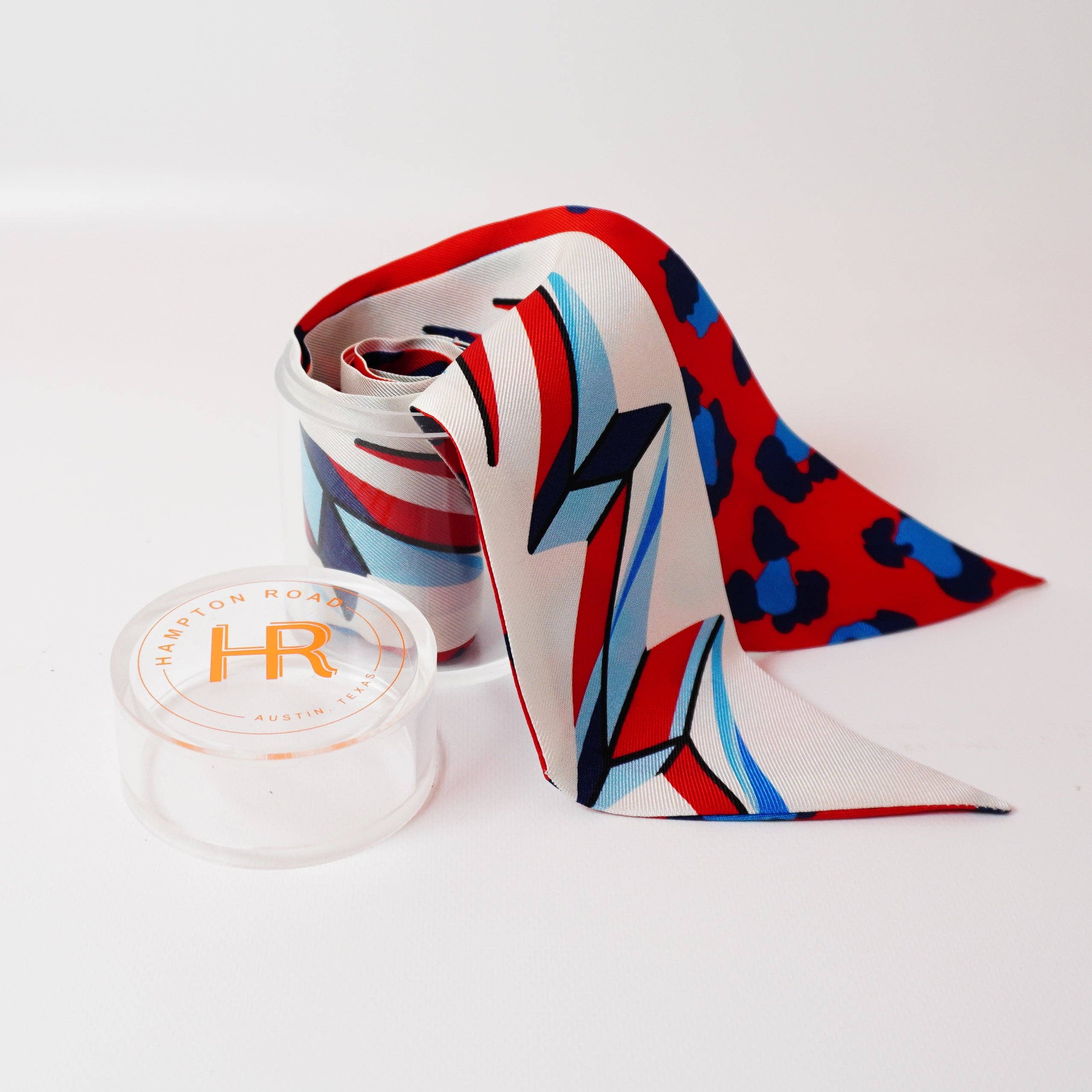 a red white and blue tie with a blue and red design on it