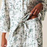 a person wearing a white and green pajamas
