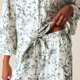 a person wearing a white and green pajamas
