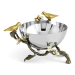 a silver bowl with gold birds on it