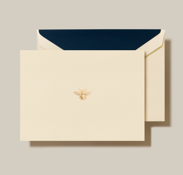 a white envelope with a bee on it