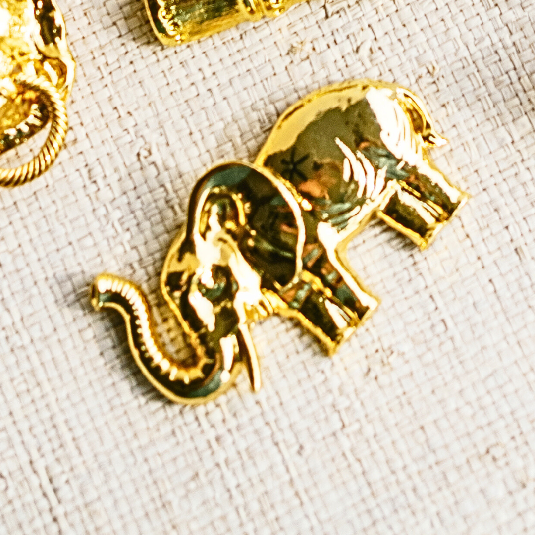 a gold elephant and other objects