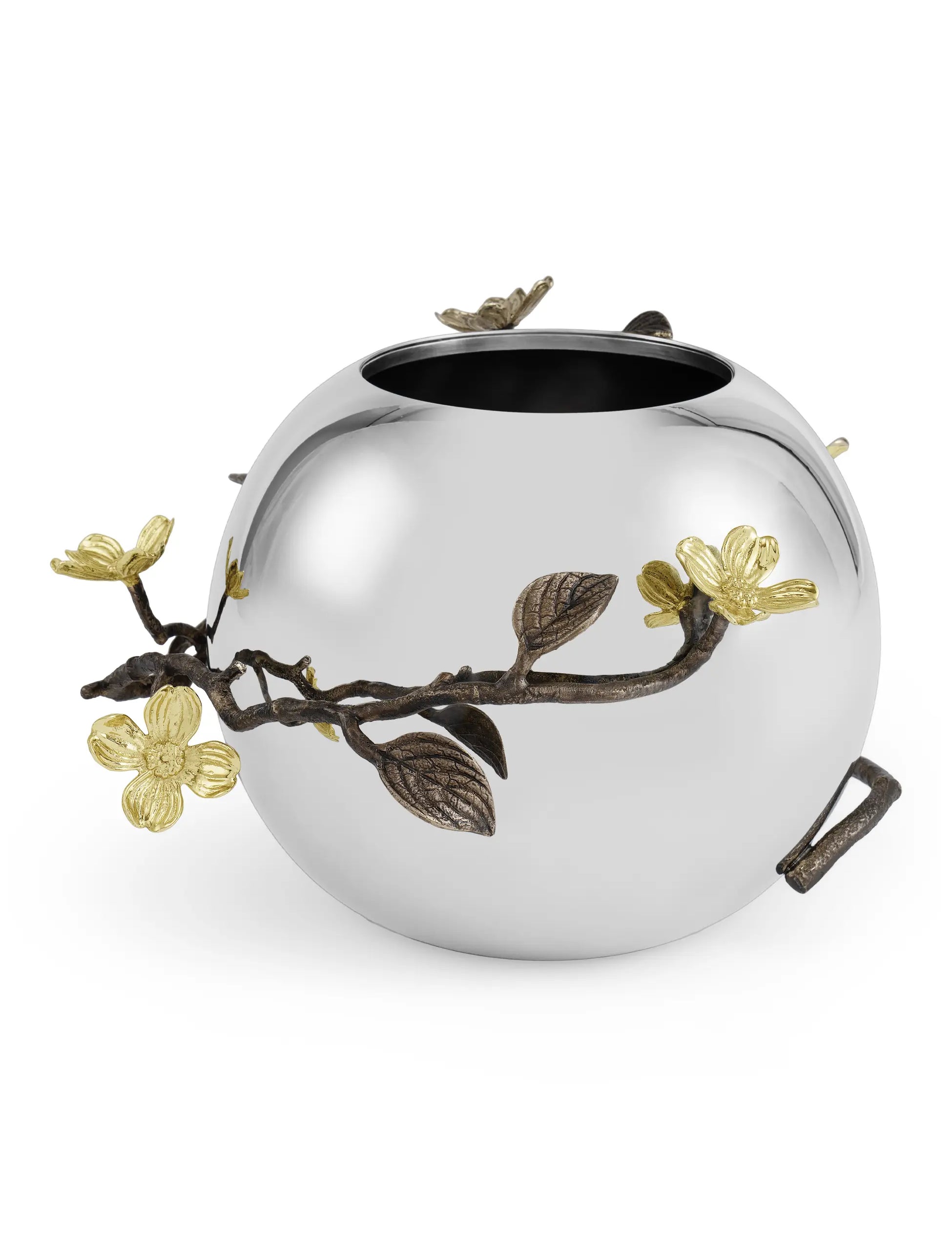 a silver vase with a branch and flowers