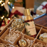 a box with a bottle and ornaments