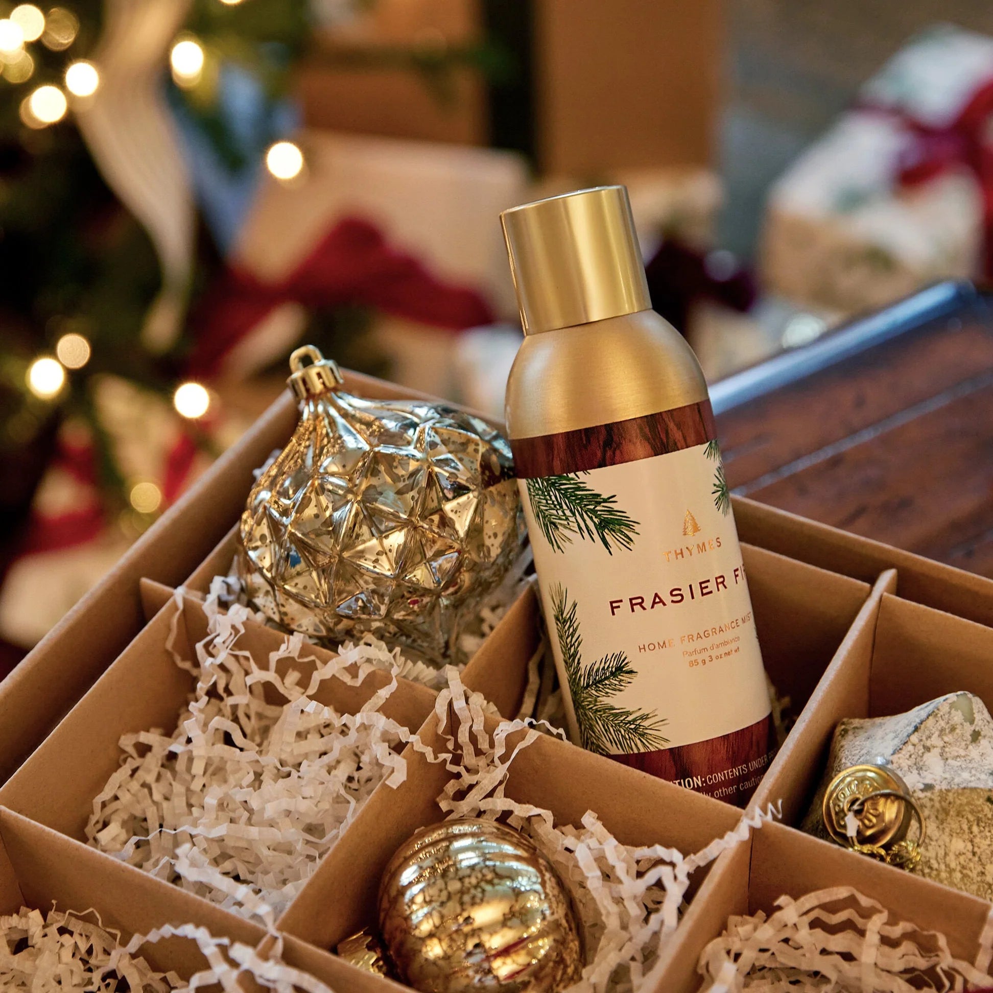a box with a bottle and ornaments