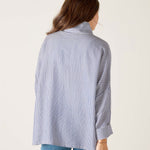 a woman in a striped shirt