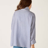 a woman in a striped shirt
