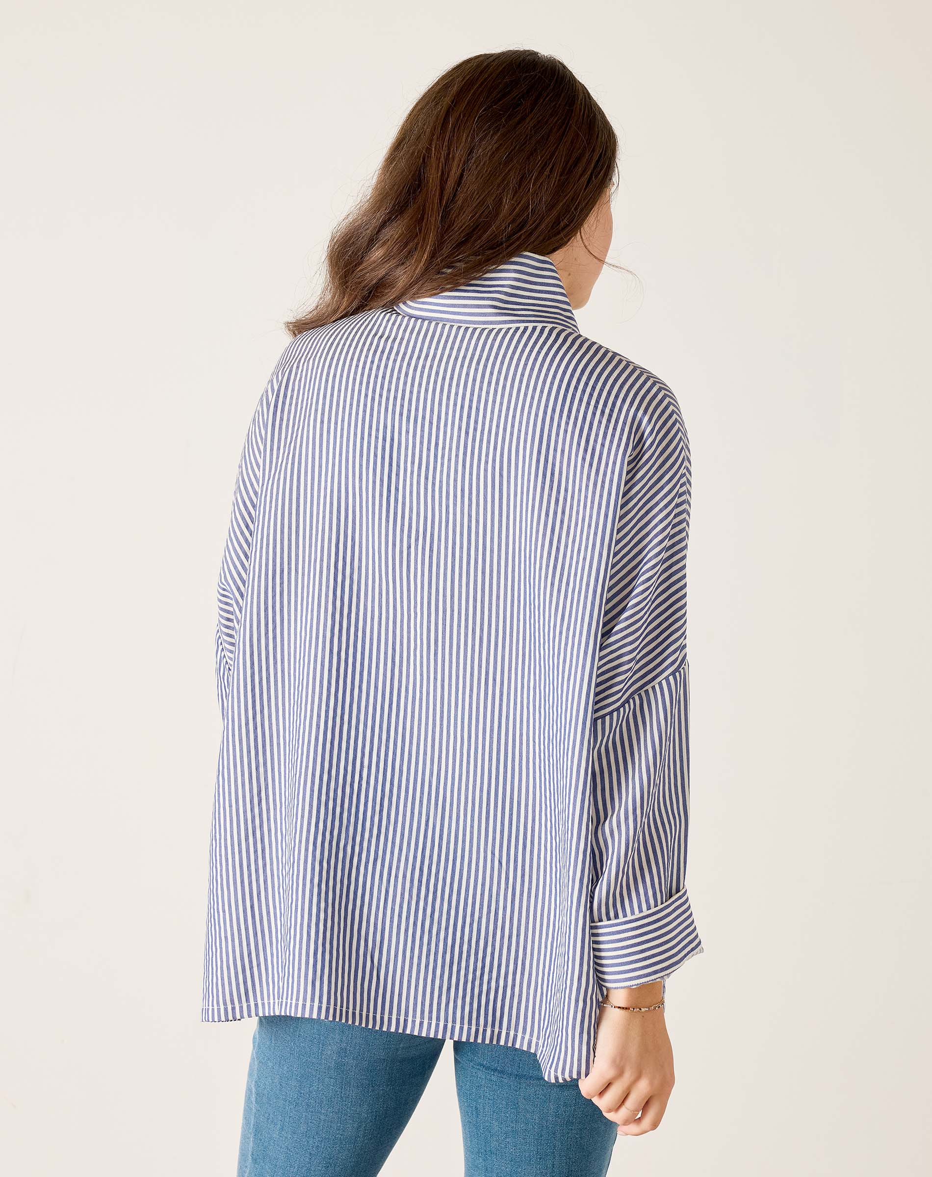 a woman in a striped shirt