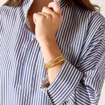 a woman wearing a striped shirt