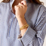 a woman wearing a striped shirt