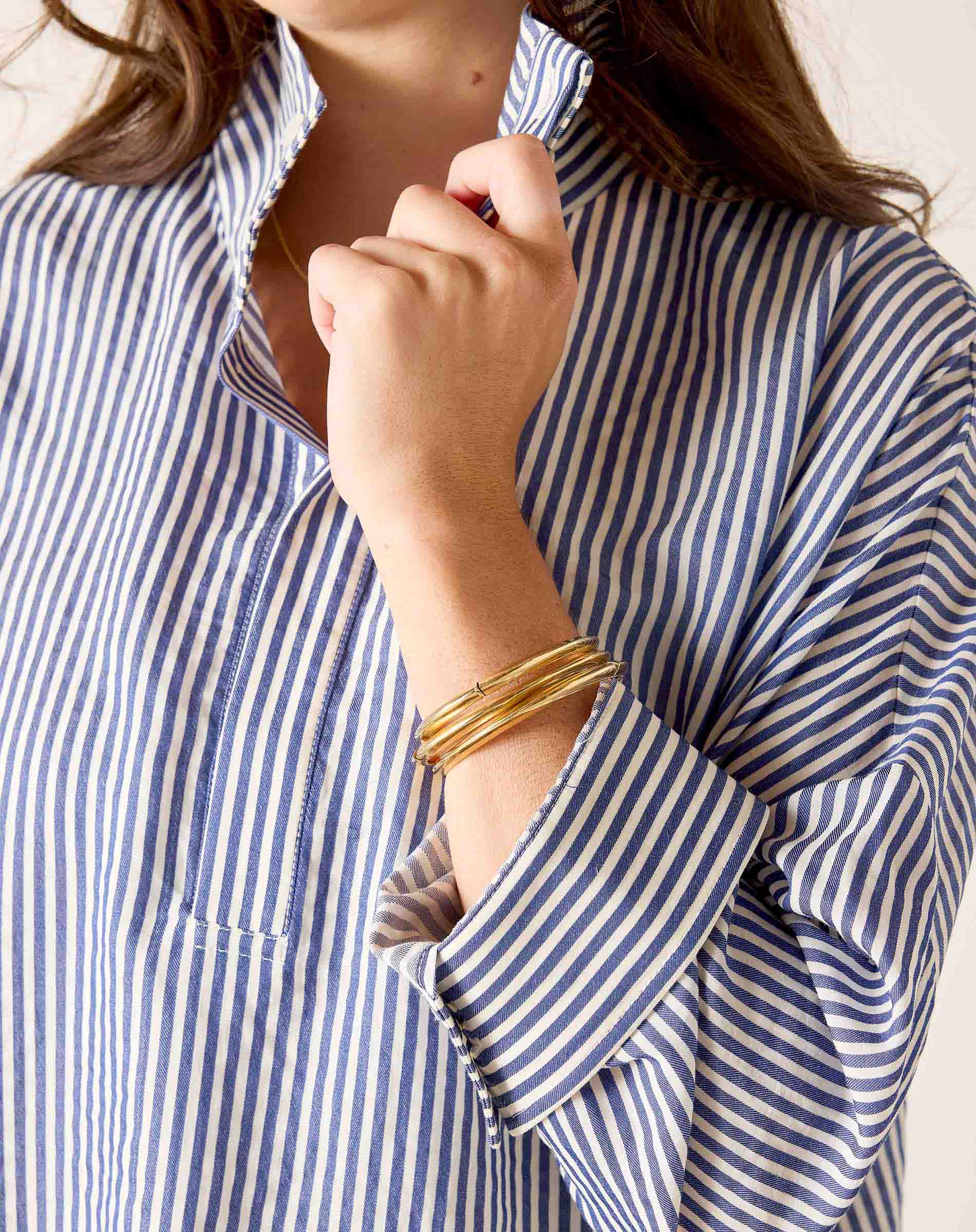 a woman wearing a striped shirt