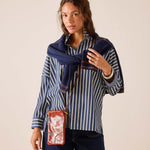 a woman in a striped shirt
