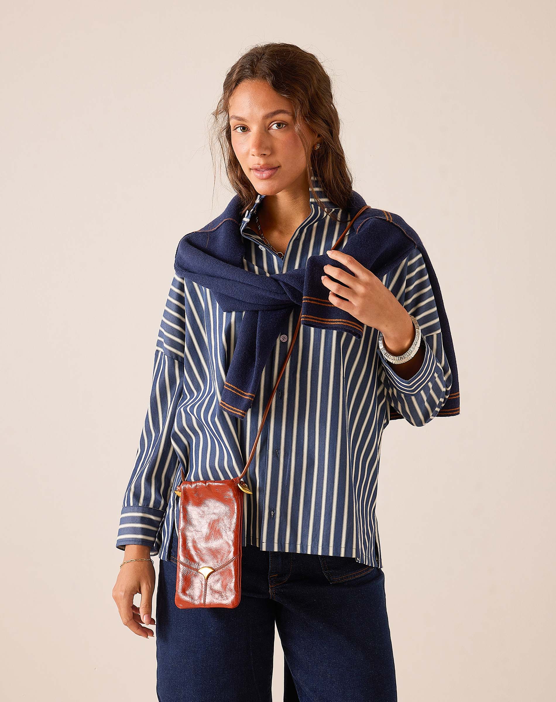 a woman in a striped shirt