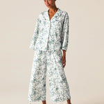 a woman wearing a white pajama