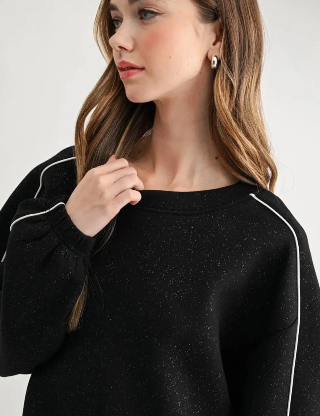 a woman in a black sweater