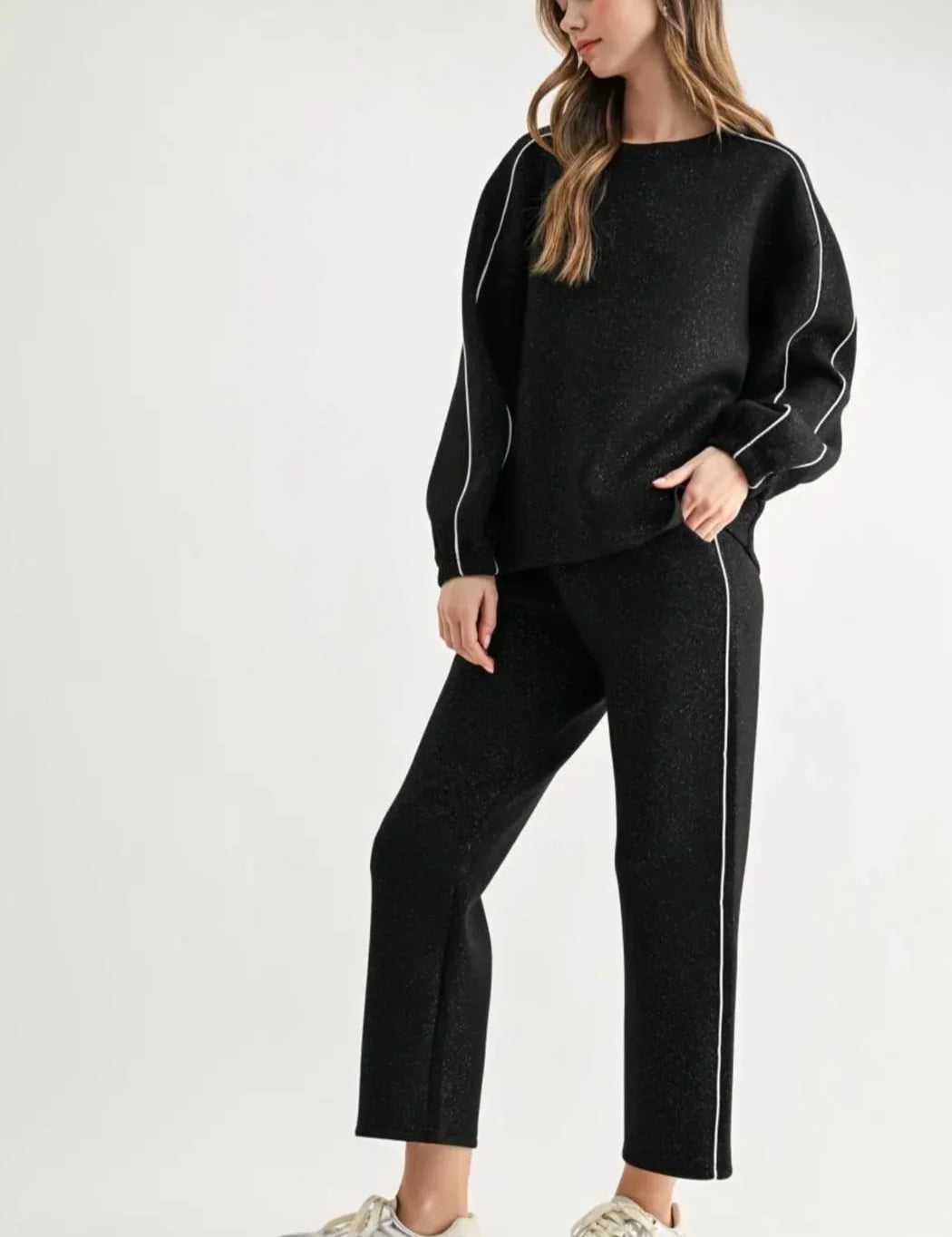 a woman in a black outfit