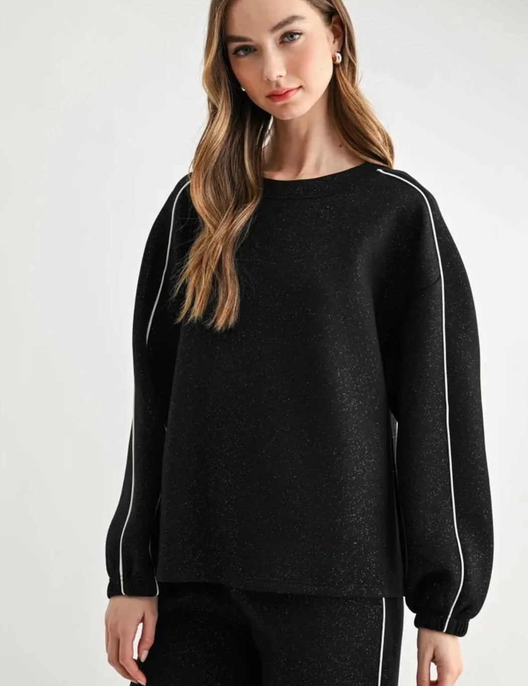 a woman in a black sweater