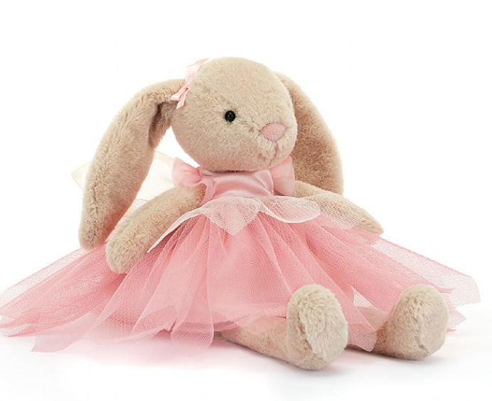 a stuffed animal in a pink dress