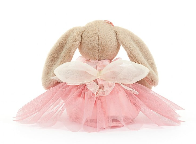 a stuffed animal in a pink dress