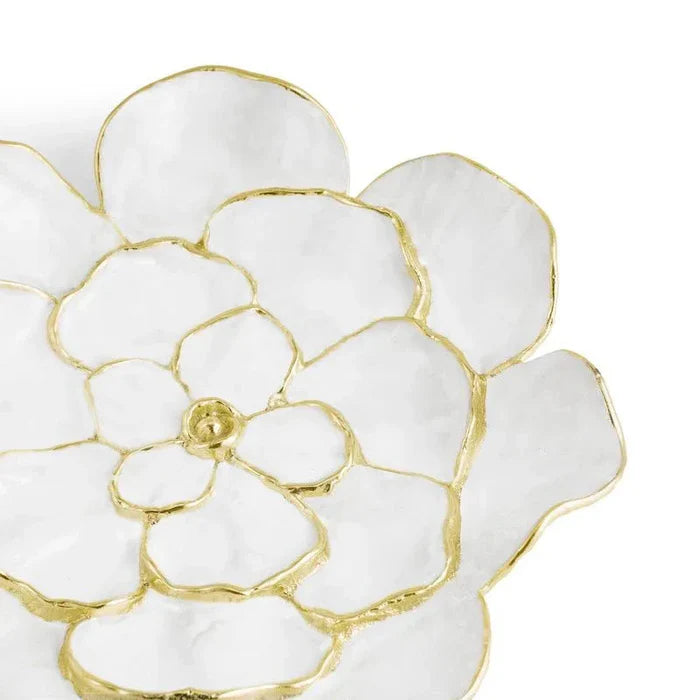 a white and gold flower