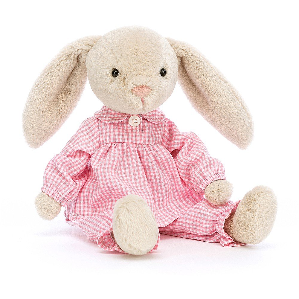 a stuffed animal in a pink dress