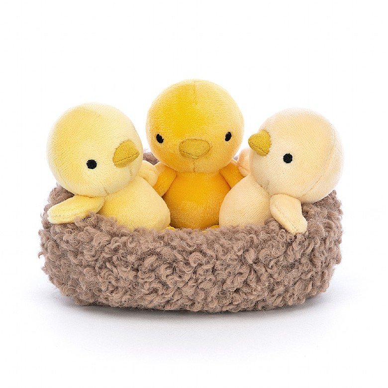 a group of yellow stuffed animals in a basket