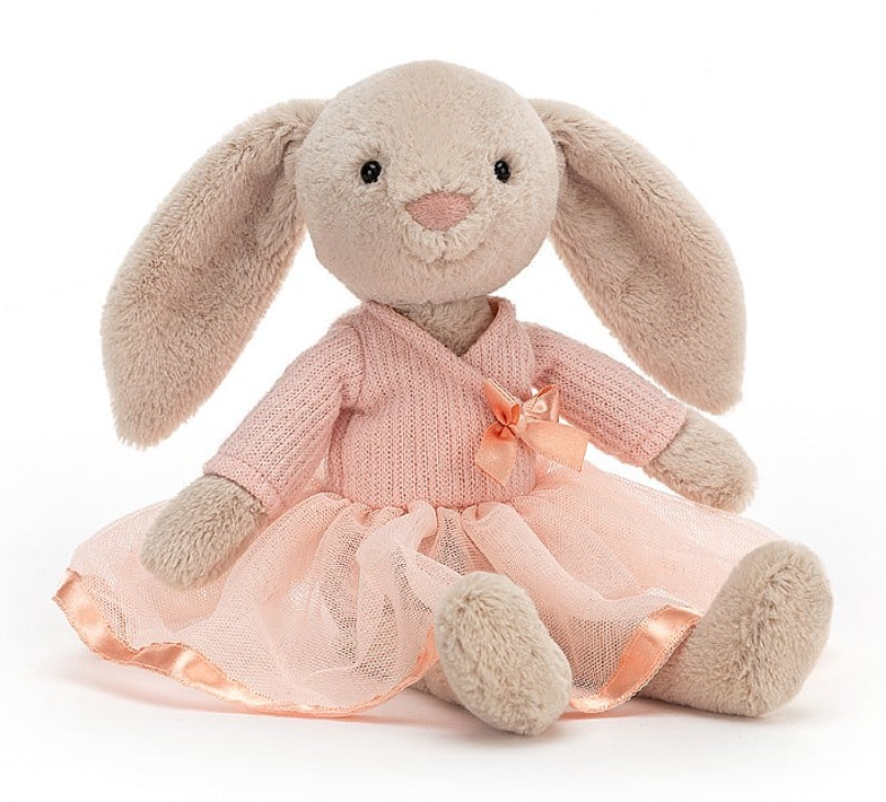 a stuffed animal in a pink dress