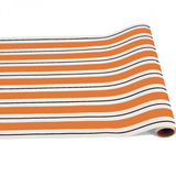 a roll of orange and white striped wrapping paper